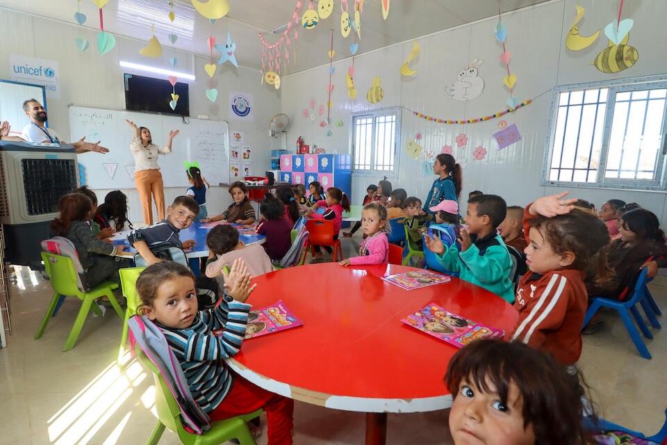 Young children attend an early childhood education class at a UNICEF -supported center in Ain Khadra camp in Al-Malikiyeh, Al-Hasakeh, Syria, on Sept. 21,  2023.