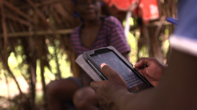 Data collected at community level is captured using locally-made tablets. (c) UNICEF Haiti/2014/Nybo