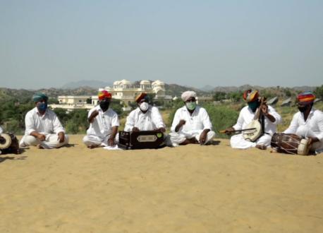 Folk musicians in Rajasthan, India, sing a traditional song rewritten to convey key messages about defeating COVID-19 with the vaccine.