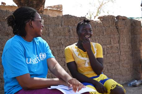 Chatting with a UNICEF staffer in Dedougou, Burkina Faso, 15-year-old Valerie says she's very glad that social workers convinced her not to marry early.