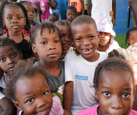 Children await screening for malnutrition at the UNICEF-supported nutrition site in Delmas, Haiti.
