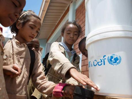 Children Get Water from UNICEF Jug