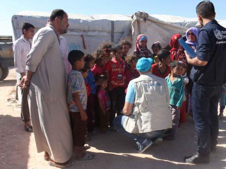 UNICEF speaks with displaced mothers and children living in make-shift tents and shelters in the neighborhood of Majabel, western Aleppo city, Syria.