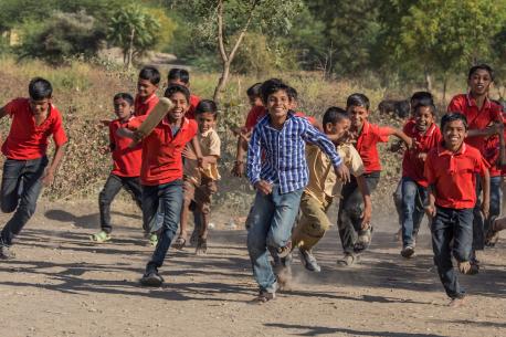 Primary school students in Aurangabad, Maharashtra state, India, after playing a cricket match organized by a UNICEF-supported program emphasizing social change through sport.
