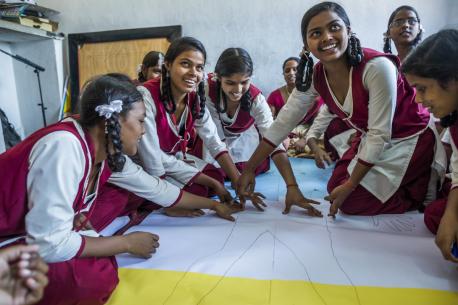 Adolescent girls in Jharkhand, India, participate in a body-mapping activity, part of a UNICEF-supported program to improve menstrual health and hygiene and help girls stay in school.