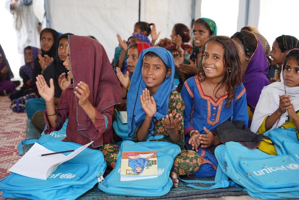 On Sept 16, 2022, children attend a class at the temporary learning center established by UNICEF in a camp for flood-affected people near Moenjodaro, Larkana District, Sindh, Pakistan.