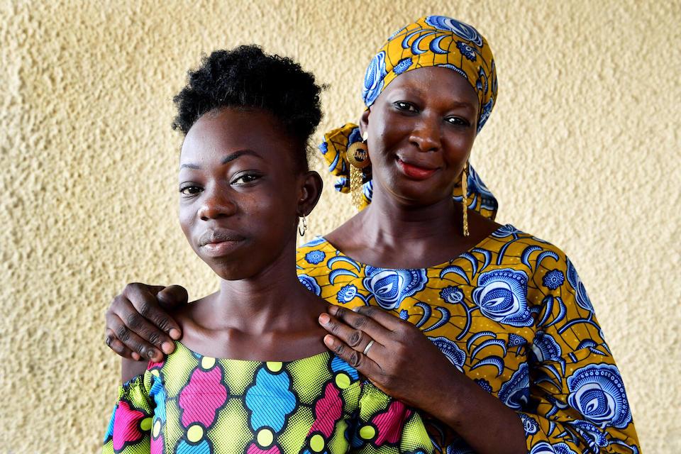 Lonedrakissa Kone, 12, with her mother Mawa Savane, 43, in Anyame, a suburb of Abidjan, south Côte d’Ivoire.