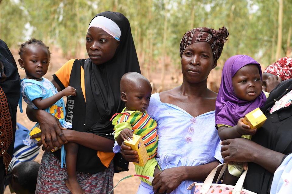 Woman and children at a malnutrition screening session in the village of Ngolo, in the Northern region of Burkina Faso.