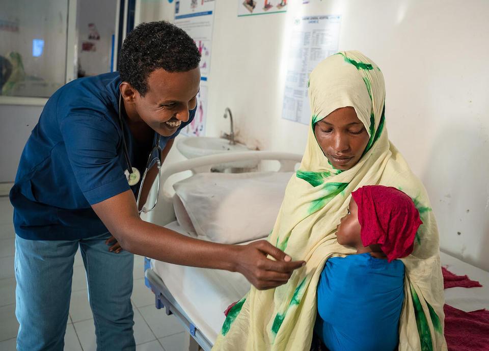 1-year-old Aisha is greeted by Dr. Isse Hassan at the UNICEF-supported Garowe General Hospital Stabilization Center where she is recovering from severe acute malnutrition.