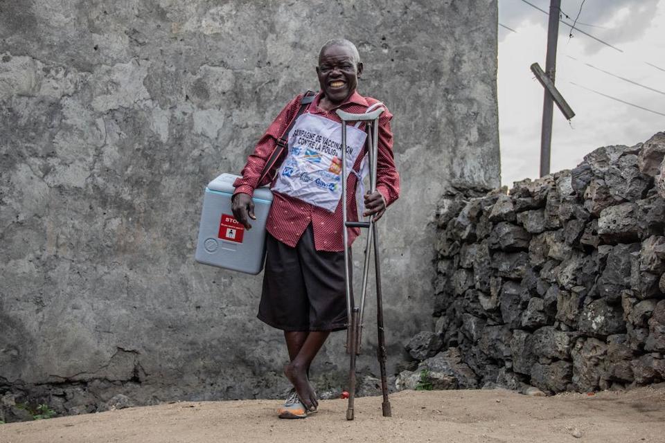 Joseph, a volunteer vaccinator in in the Maniema Province of the Democratic Republic of Congo, gets around on crutches having contracted polio at the age of 5.