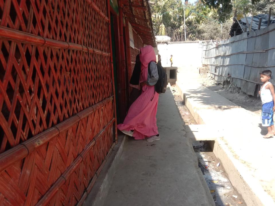 In Cox's Bazar, Bangladesh, Roshida, a Rohingyan refugee from Myanmar, enters a learning center supported by UNICEF and Education Cannot Wait.