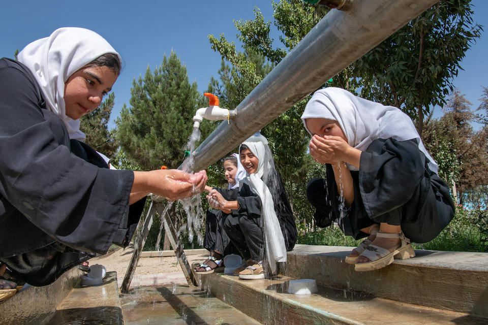 Students wash their faces and hands at a school in Balkh Province, Afghanistan in June 2023. 