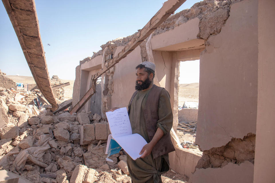 On Oct. 10, 2023, Fazil Ahmad Khan stands in the rubble of his destroyed home in Zinda Jan district, Afghanistan, collapsed in the earthquake on Oct. 7.