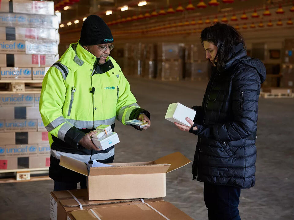 Omar Rjial, Warehouse Assistant based in Copenhagen who went on a surge mission in Ukraine, unpacks a First Aid Kit.