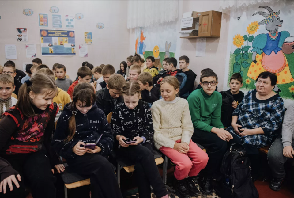 When air raid alarms sound, students head to the UNICEF-equipped bomb shelter at their school in in the Ukrainian village of Puzhaykove.