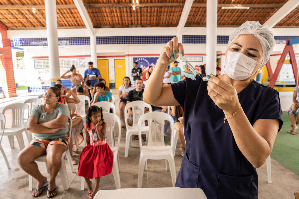 A nurse prepares a vaccine shot to be administered at the Early Childhood Education Center Rocilda Germano Arruda in Baturité, Ceará state, Brazil as part of a UNICEF-supported immunization catch-up program.