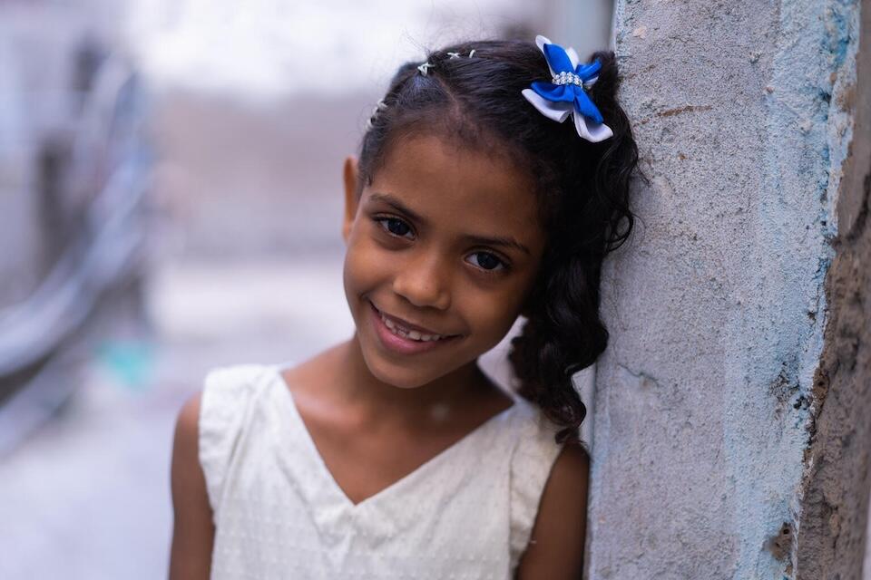 Aisha, a 10-year-old student, poses for a photographer in her neighborhood in Seerah District, Aden Governorate, Yemen, on Jan. 11, 2023.