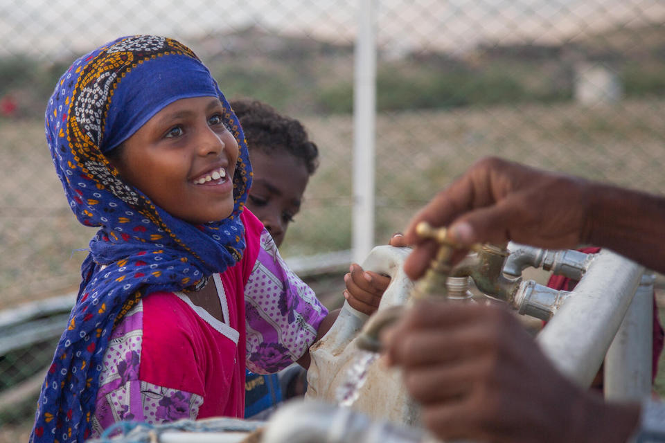 7-year-old Madina collects clean water at a new solar-powered water station UNICEF and partners installed in the small village of Gelhanty in Agig locality, Red Sea state, Sudan.