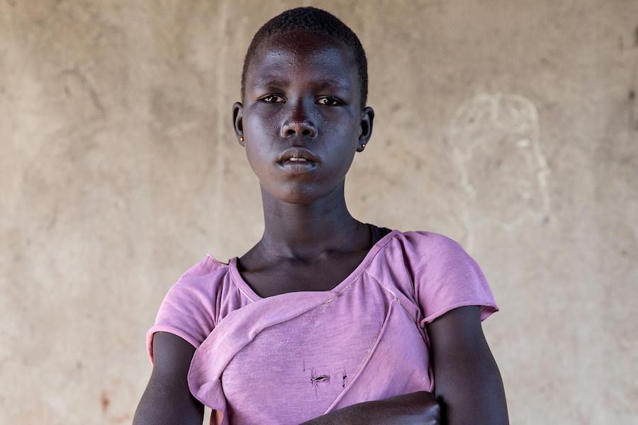 Elizabeth, 14, lost both her parents in the South Sudanese civil war. She arrived in Uganda&#039;s Bidi Bidi refugee camp with her sister and two brothers.