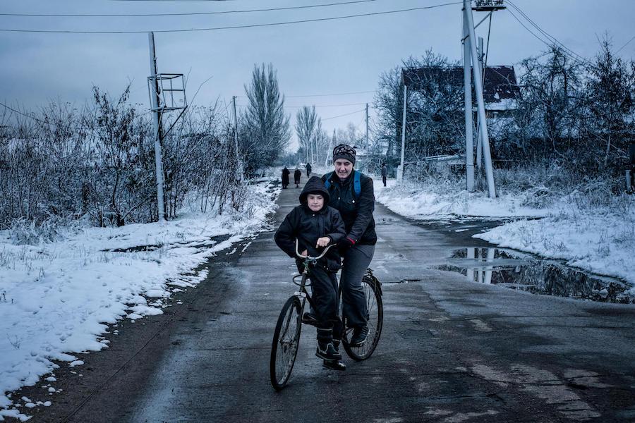 Misha, 9, and his mother live in the "grey zone" in Marinka, Donetsk Oblast, Ukraine, November 2017. Marinka sits on the contact line that divides government and non-government controlled areas in eastern Ukraine. 