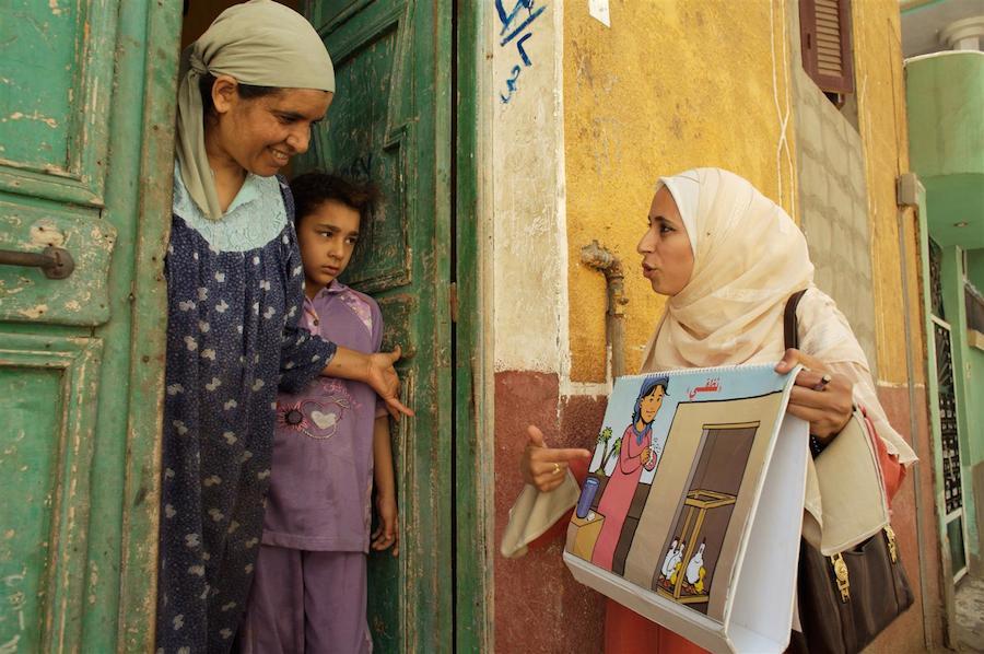 A UNICEF-trained community health worker makes a home visit to a family in Egypt with information about how to prevent the spread of avian flu.