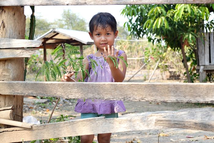 Four-year-old Treza proudly shows her left little finger, marked after she received a complete dose of polio vaccine in Baw La Khe, Myanmar. 