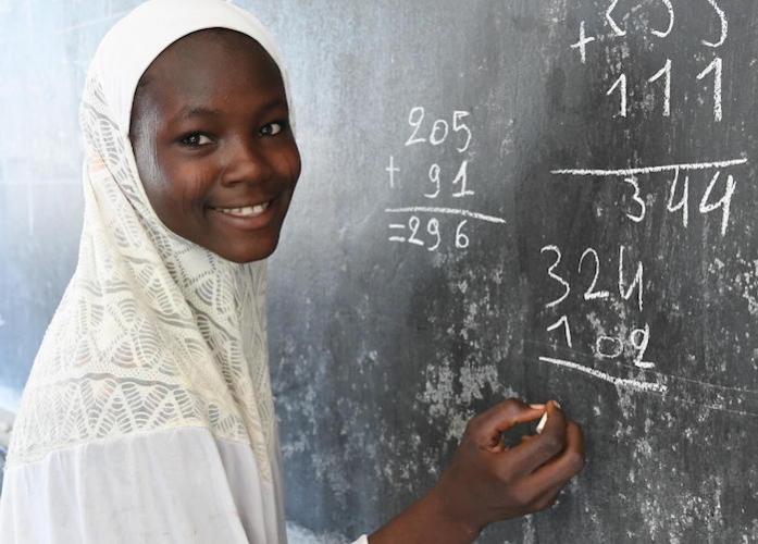 Matram, 13, at the blackboard of the Noma school, in Maradi, southern Niger.