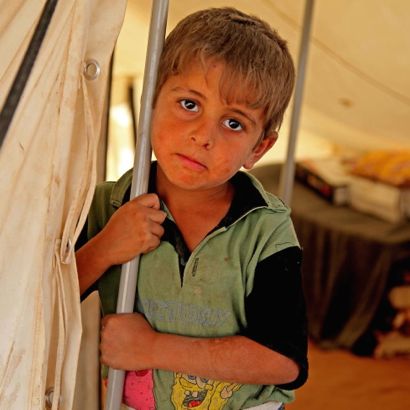 5-year-old Ali Saleh, whose family has been displaced from the Kokjeli area in the conflict-affected city of Mosul, stands by a pole at the entrance to a tent in the Khazar transit camp in the northern-eastern city of Erbil, capital of Kurdistan Region 5-year-old Ali Saleh, whose family has been displaced from the Kokjeli area in the conflict-affected city of Mosul, stands by a pole at the entrance to a tent in the Khazar transit camp in the northern-eastern city of Erbil, capital of Kurdistan Region