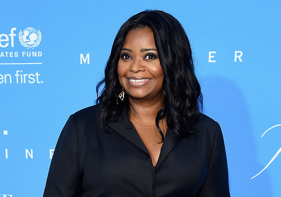 Octavia Spencer poses on the blue carpet