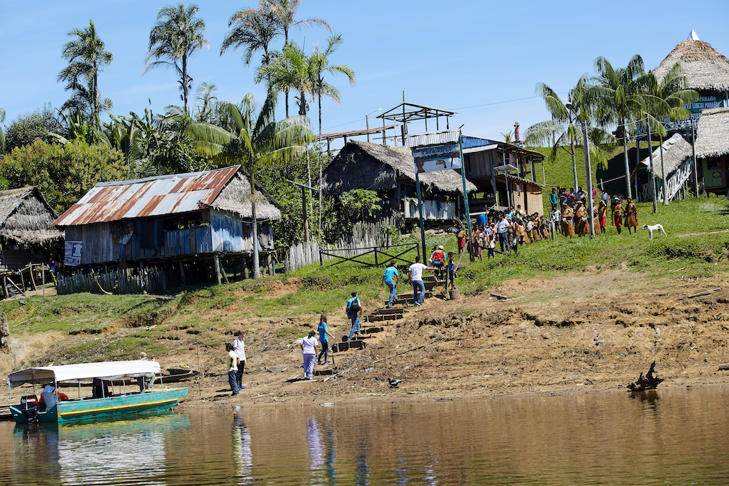 UNICEF field visitors traveled by boat to meet with members of the Urco Miraño community in Mazan, Peru. 