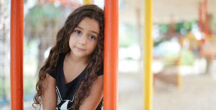 Hanan, 8, participates in UNICEF-supported psychosocial support activities at the Karantina public garden in Beirut, which was set up after the port explosion.