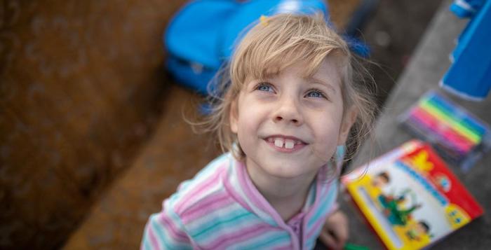Vika, 7, of eastern Ukraine, received a backpack full of learning supplies from UNICEF to support her start at school.