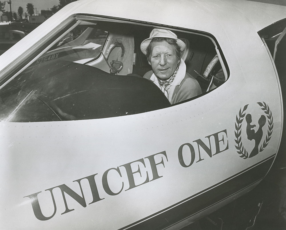 UNICEF Goodwill Ambassador Danny Kaye in the cockpit of his “UNICEF One” airplane, which he used to visit children in 65 North American cities in five days.