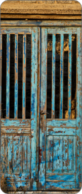 A wooden gated blue door