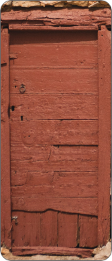 A rickety wooden brown door