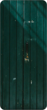 A wooden green door