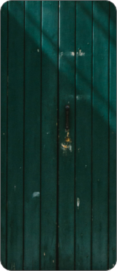 A wooden green door