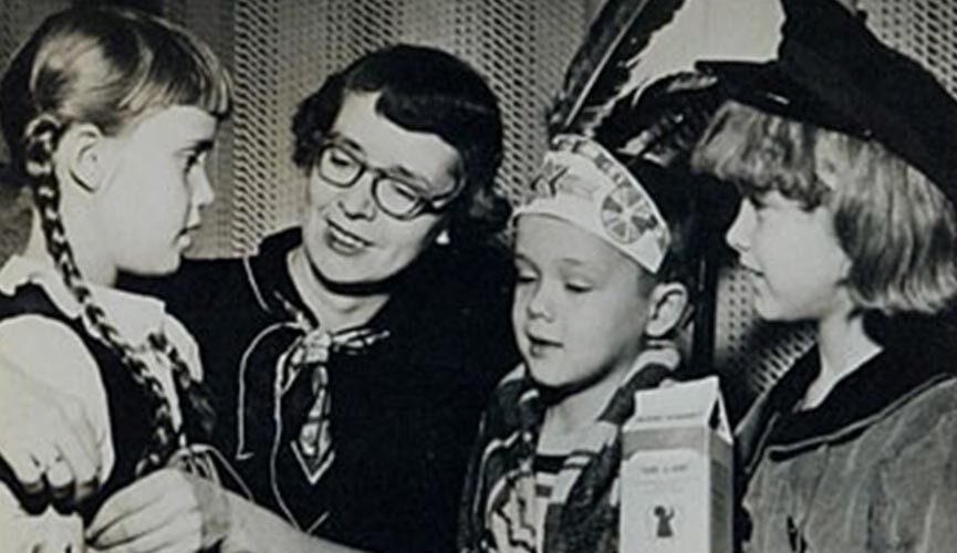 Black and white photo of Mary Emma Allison sitting among three children