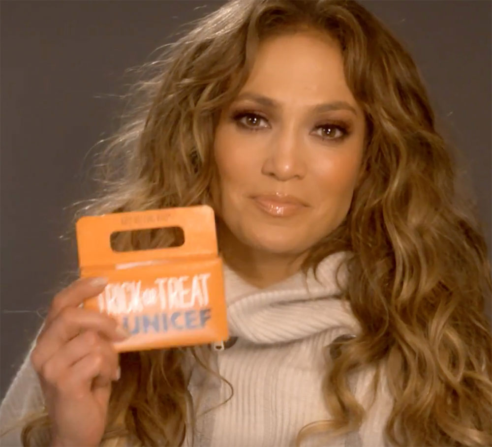 Jennifer Lopez holds up a Trick-or-Treat for UNICEF box while appearing in a PSA helping UNICEF raise funds for hurricane relief for Puerto Rico and other islands in the Caribbean.