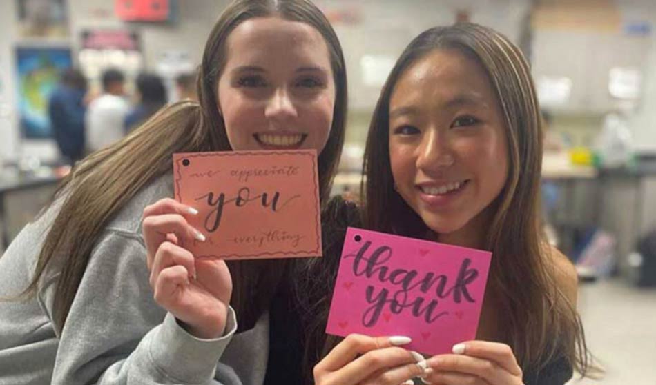 UNICEF Clubmembers hold up thank-you notes written to health care workers.