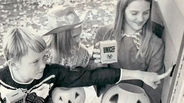 Children in costume trick-or-treating for UNICEF