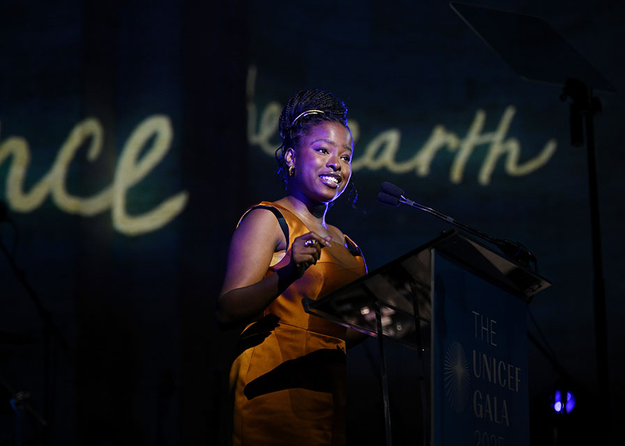 Amanda Gorman speaks at a podium on stage