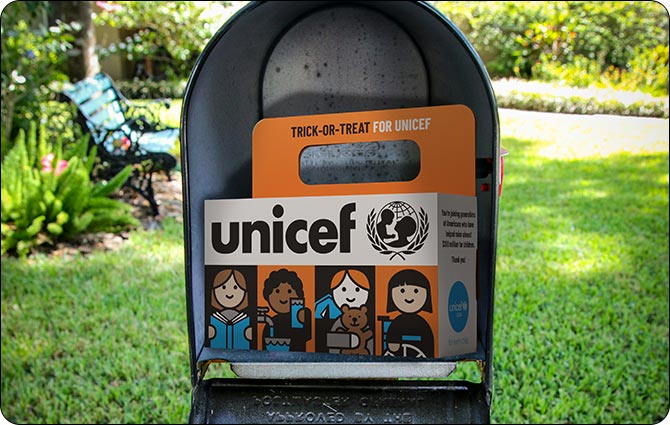 An open mailbox with a Trick-or-Treat for UNICEF box in it.