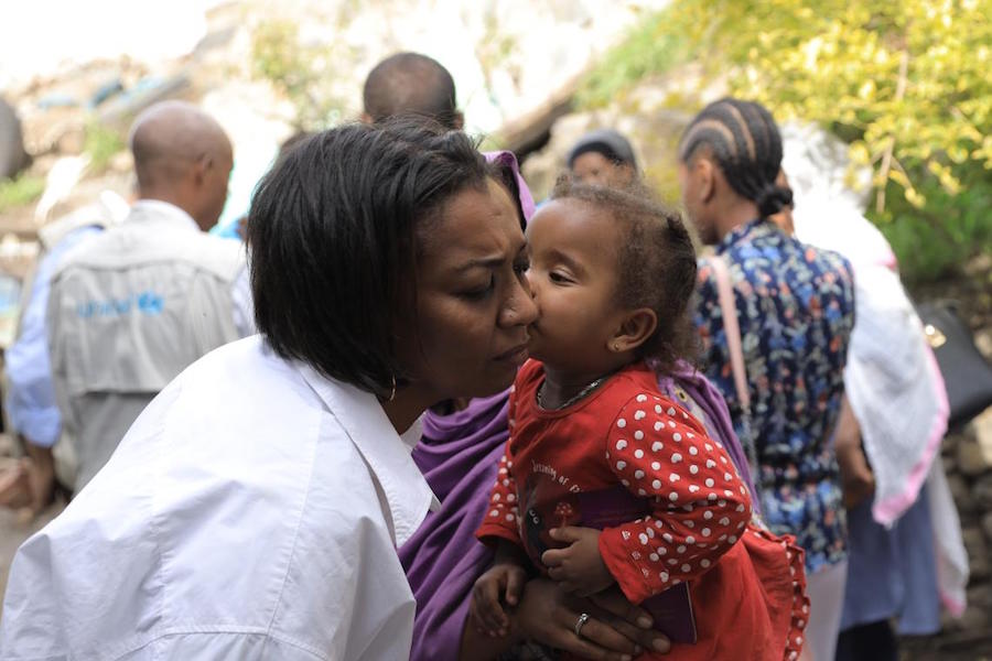 On a recent visit to Dessie town in Ethiopia's Amhara region, Rania Dagash, UNICEF Deputy Regional Director for Eastern and Southern Africa (in white shirt) met baby Rahima and her mother, Amina, who adopted her after finding her abandoned as a newborn. 