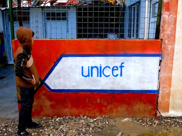 Aziz (name changed), 11, outside the TDH/UNICEF office in Debaga camp on a rainy December day. 