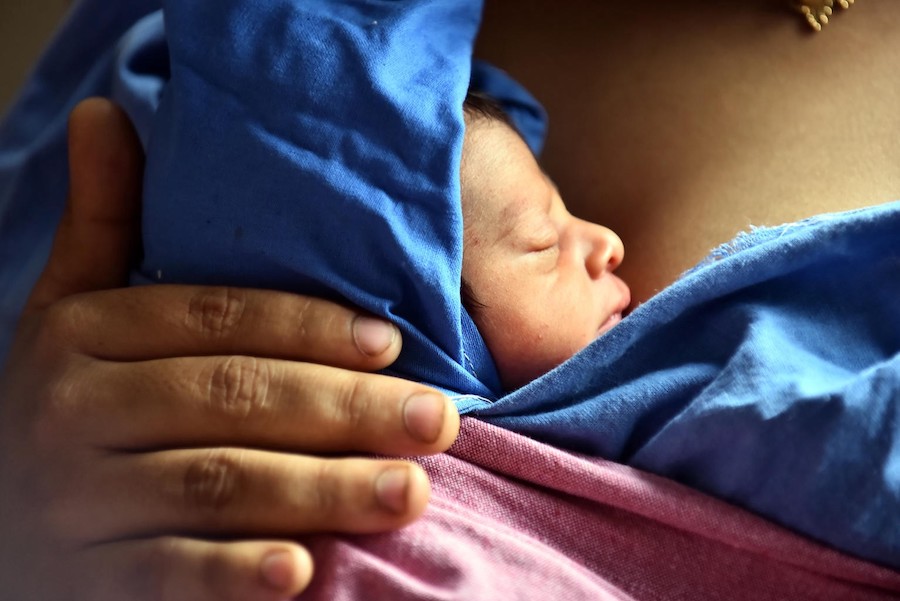 A mother holds her 1-day-old son close in the SNCU at the UNICEF-supported Beed Civil Hospital in Beed, India. 
