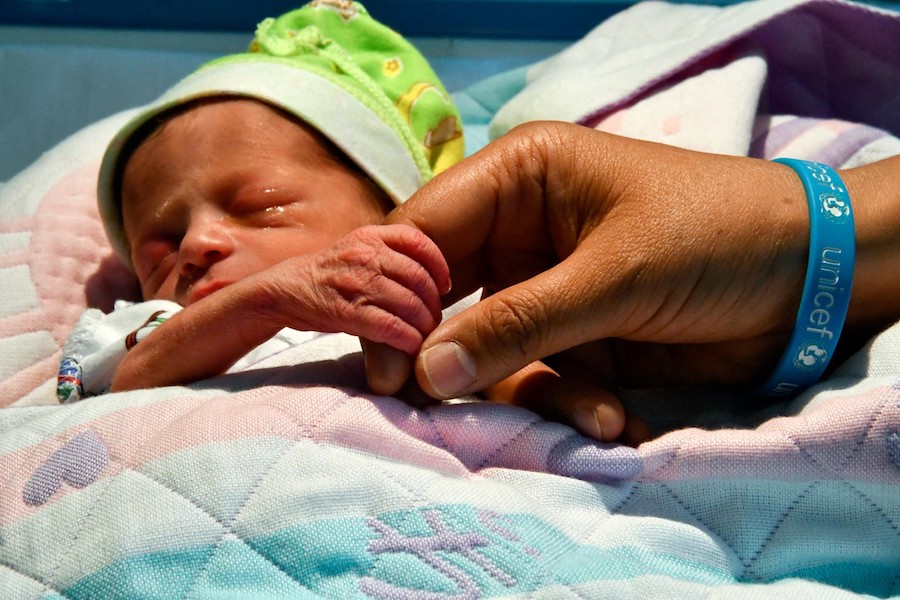 A baby born prematurely sleeps in Bishkek Maternity Hospital in Kyrgyzstan, where UNICEF, working with the government, supports training for hundreds of healthcare professionals. 