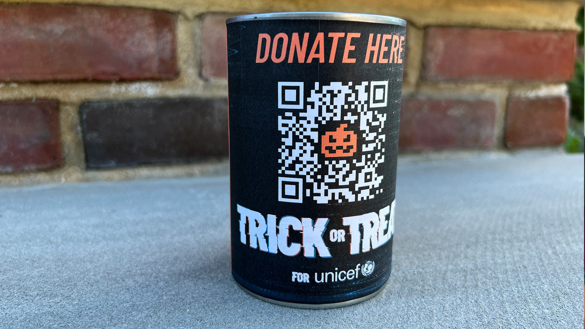 QR code label wrapped around a tin can