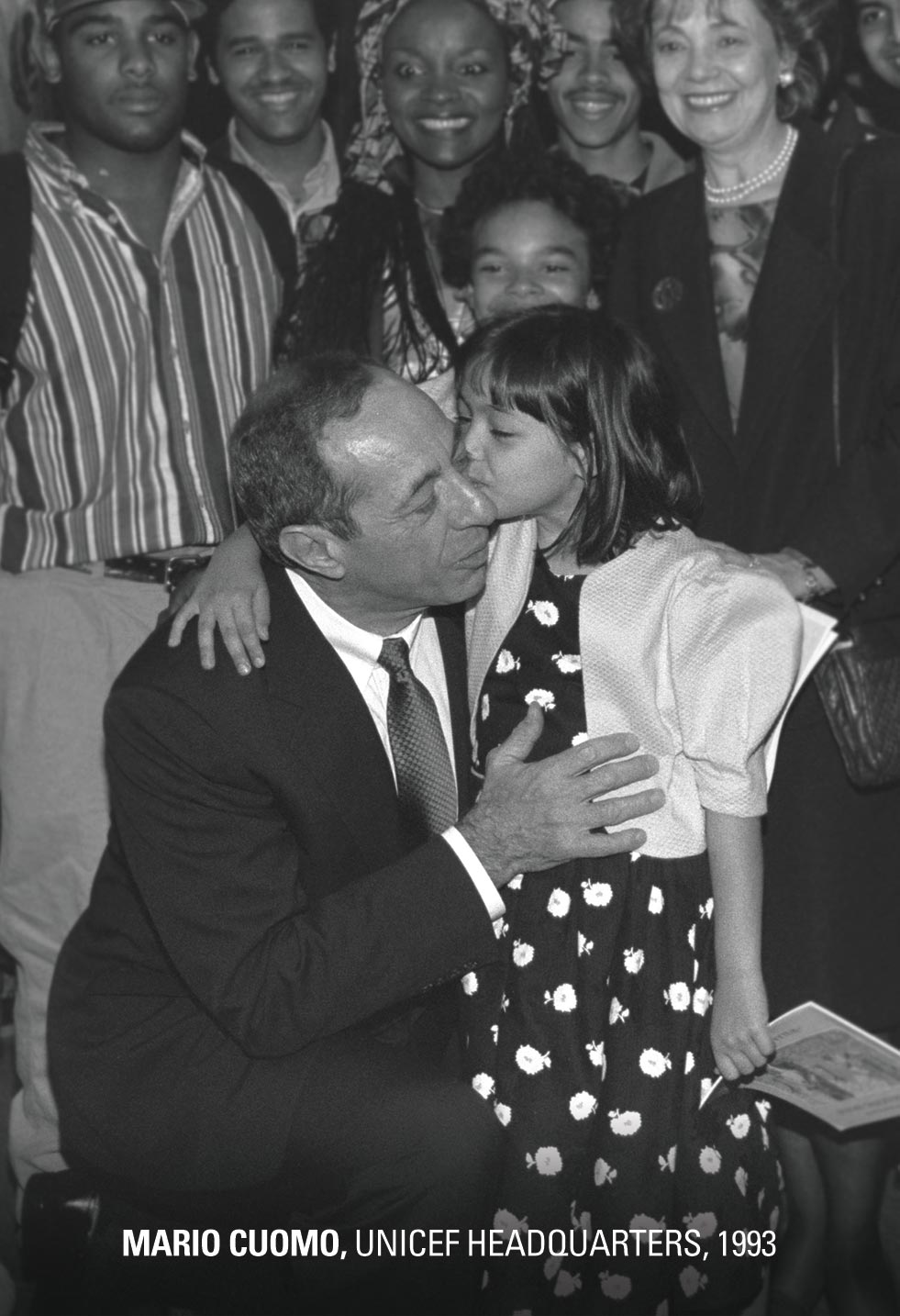 Surrounded by UNICEF staff and other guests, New York State Governor Mario Cuomo receives a kiss from his granddaughter, at the initiation of Day of the African Child celebrations at UNICEF House on 15 June, 1993.