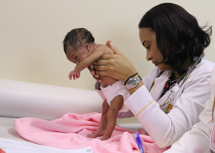 A doctor examines a newborn at San Lorenzo de Los Mina Maternal and Infant Hospital in Santo Domingo, Dominican Republic in February 2019. 